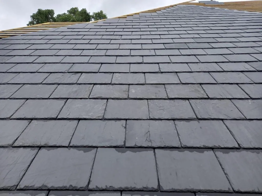 Close-up of new slate roof courses
