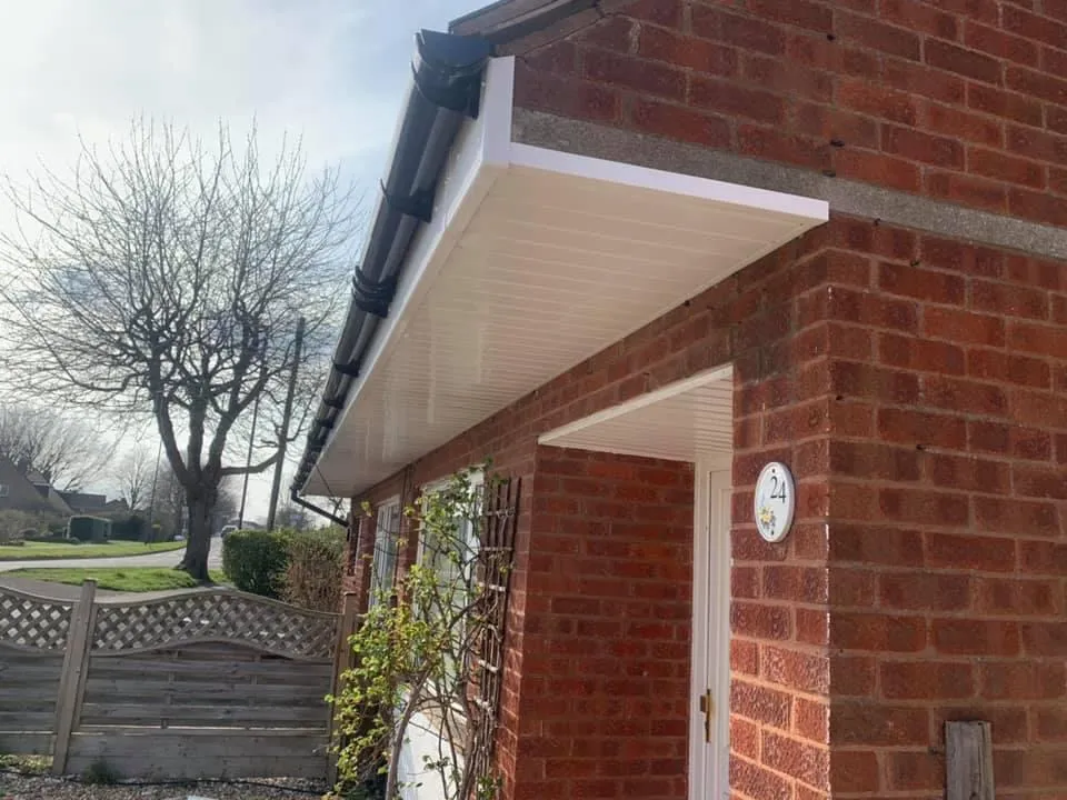 New white soffit and fascia over a front door