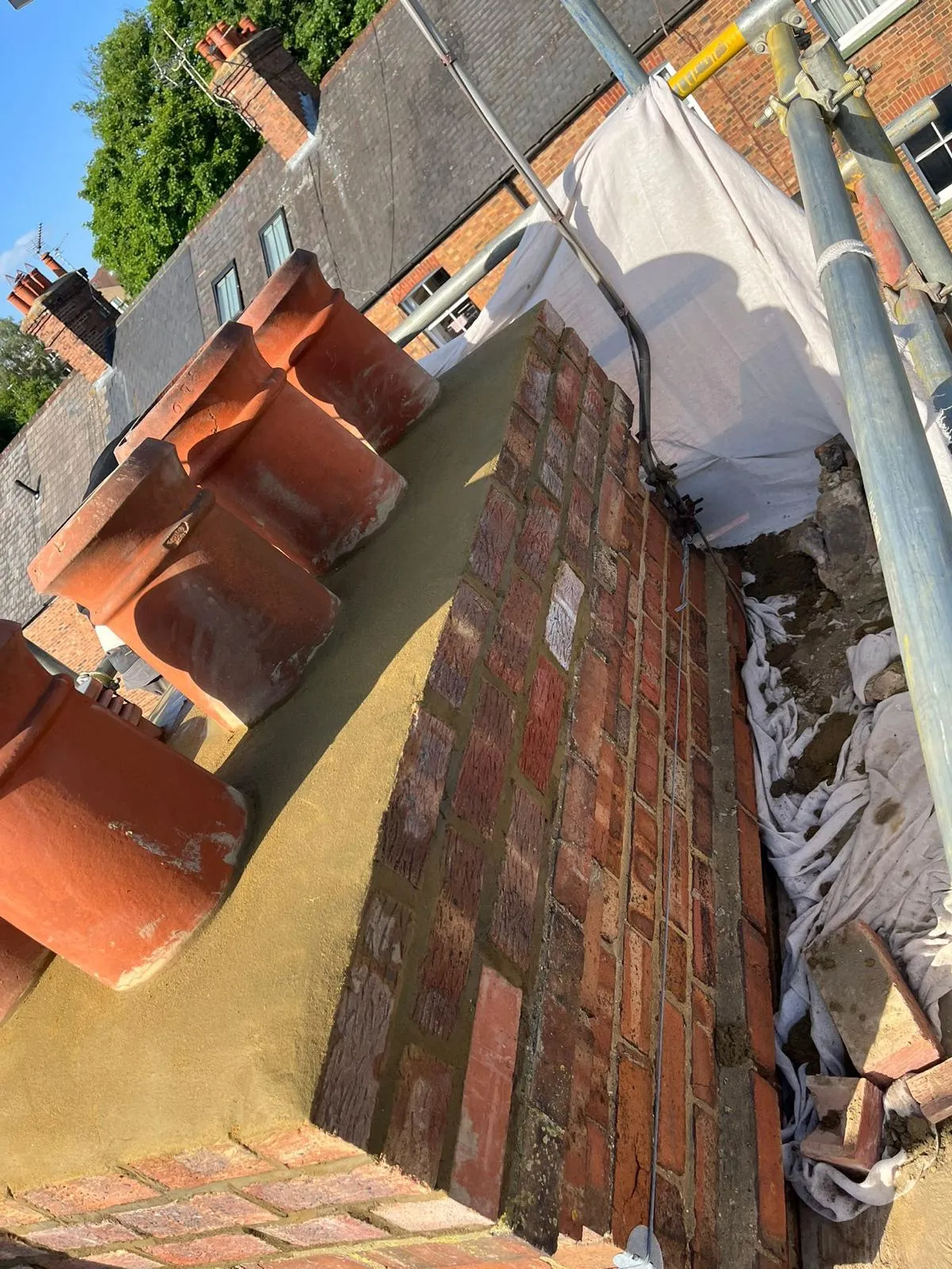 Rebuilt chimney stack with new flaunching and pots